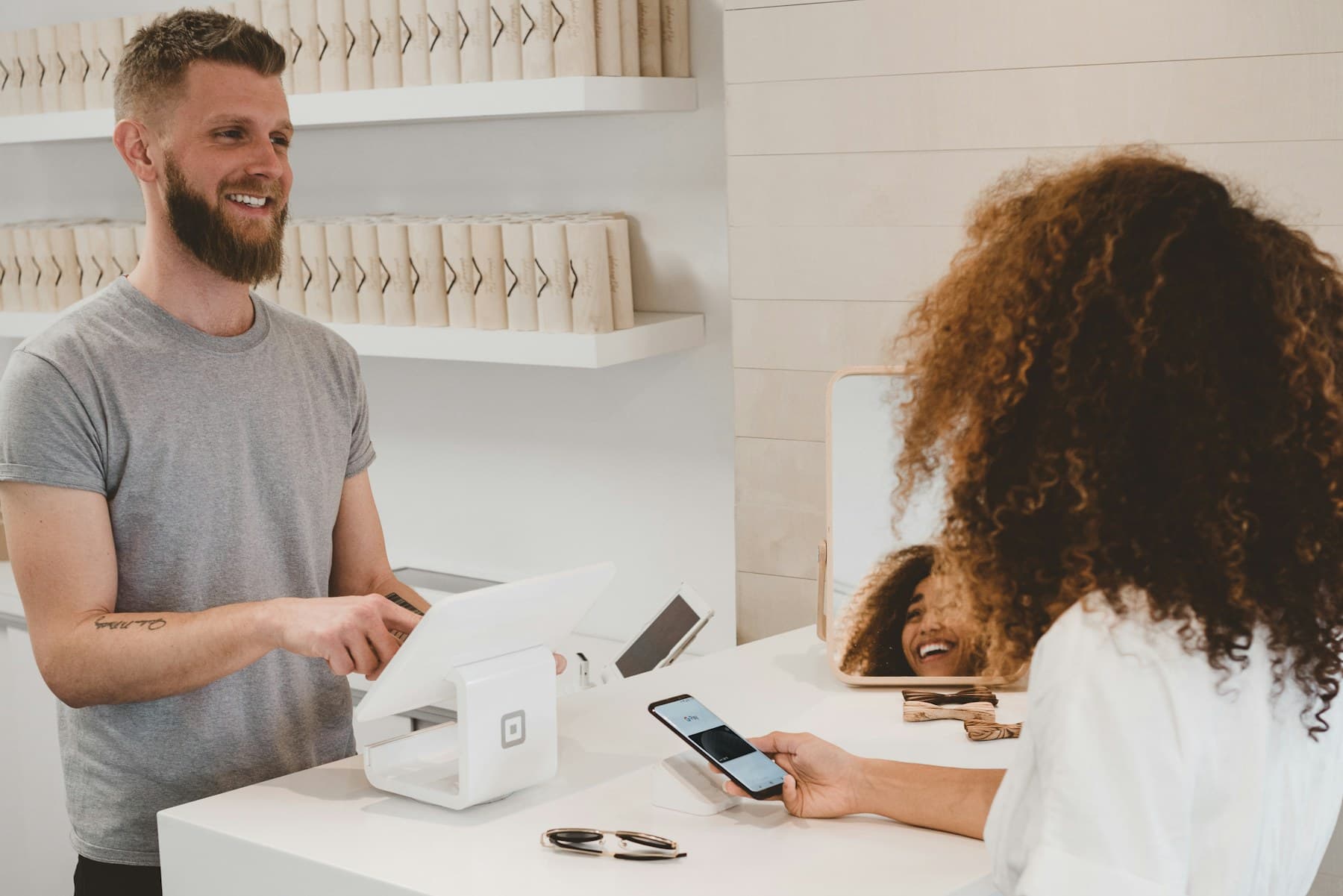 Franchise owner serving a customer at the counter